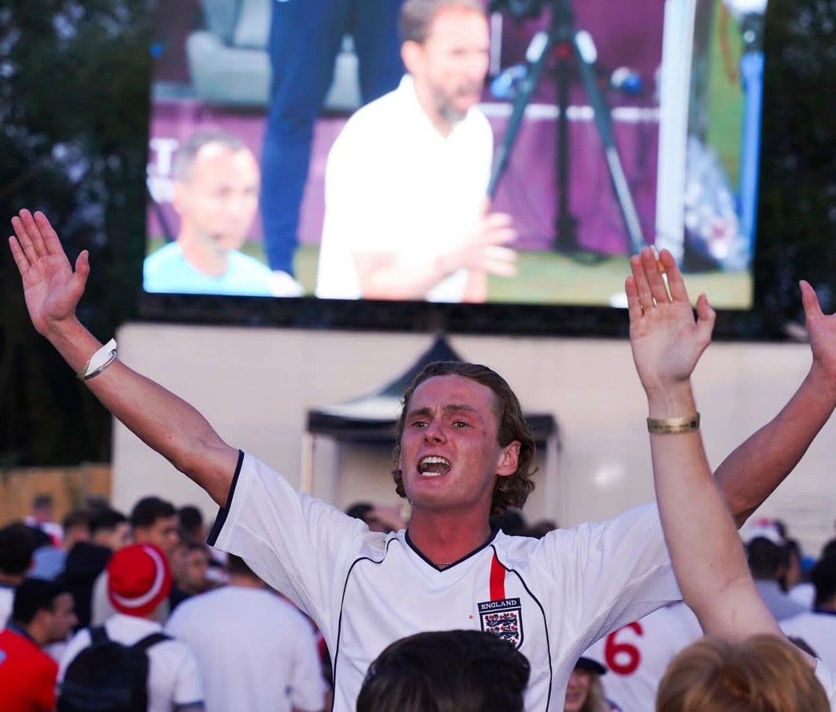 Fan celebrating at big screen